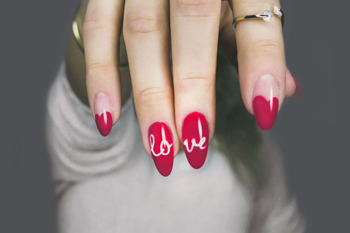 Hand-painted red nail design at London Nails Chicago
